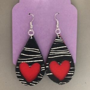 Handcrafted leather earrings with a vinyl overlay